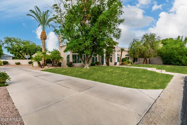 a large white kitchen with a large window
