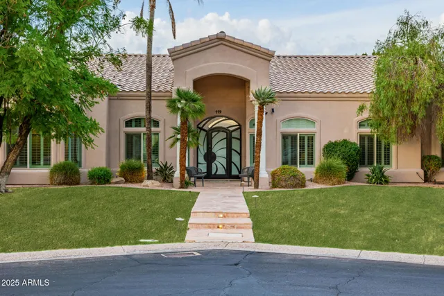 a kitchen with cabinets and stainless steel appliances