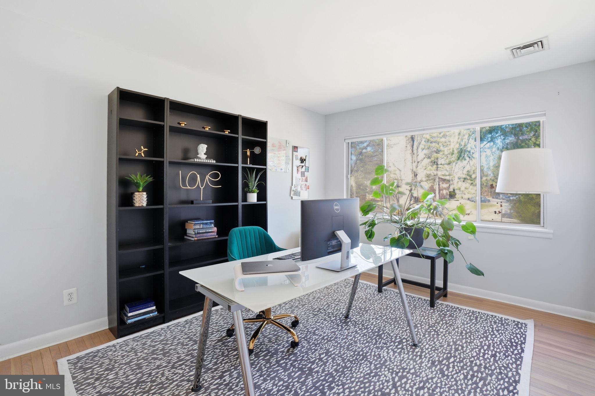 11025 Saffold Way Reston, VA 20190 - Photo 19 of 50 a workspace with furniture and a rug