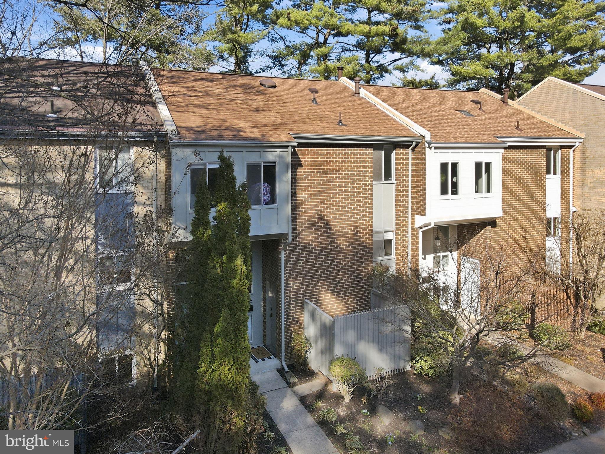 11025 Saffold Way Reston, VA 20190 - Photo 2 of 50 a aerial view of a house with a yard