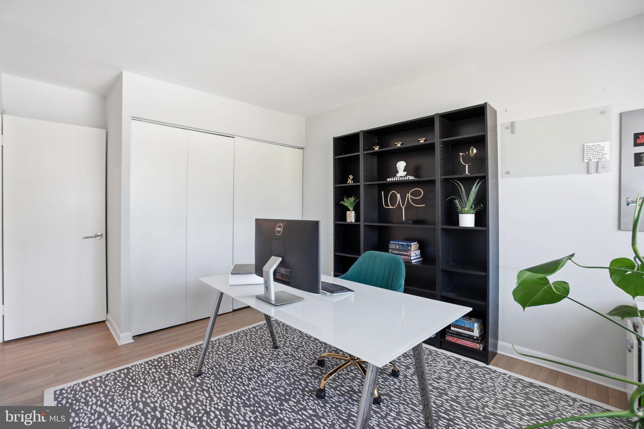 11025 Saffold Way Reston, VA 20190 - Photo 20 of 50 a workspace with furniture and wooden floor