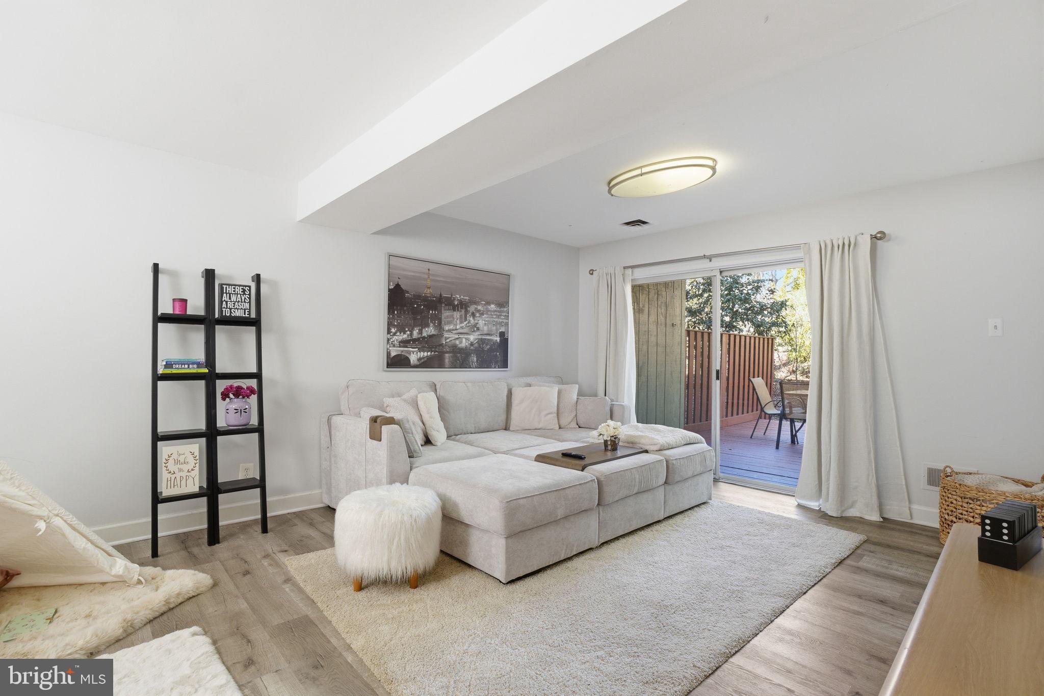 11025 Saffold Way Reston, VA 20190 - Photo 25 of 50 a living room with furniture and a window