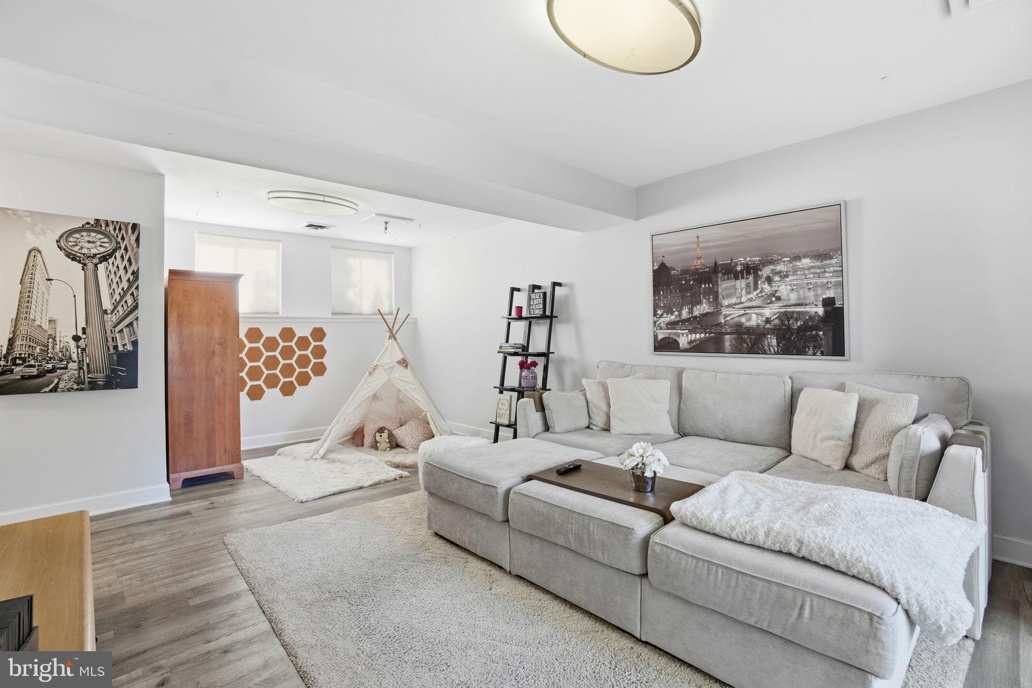 11025 Saffold Way Reston, VA 20190 - Photo 26 of 50 a living room with furniture and a large window