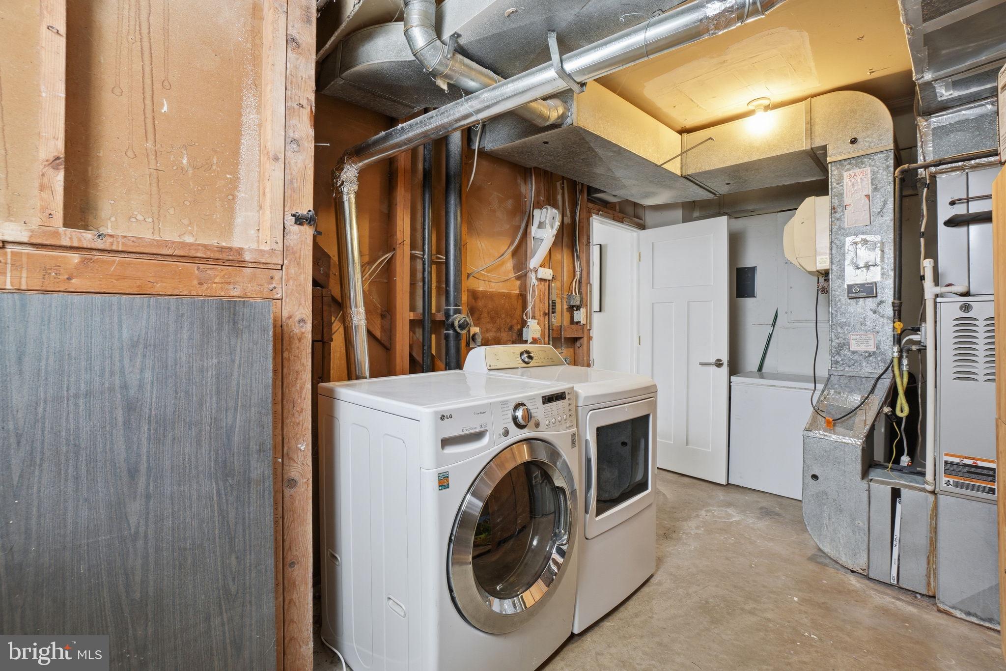 11025 Saffold Way Reston, VA 20190 - Photo 32 of 50 a view of a storage & utility room with washer and dryer