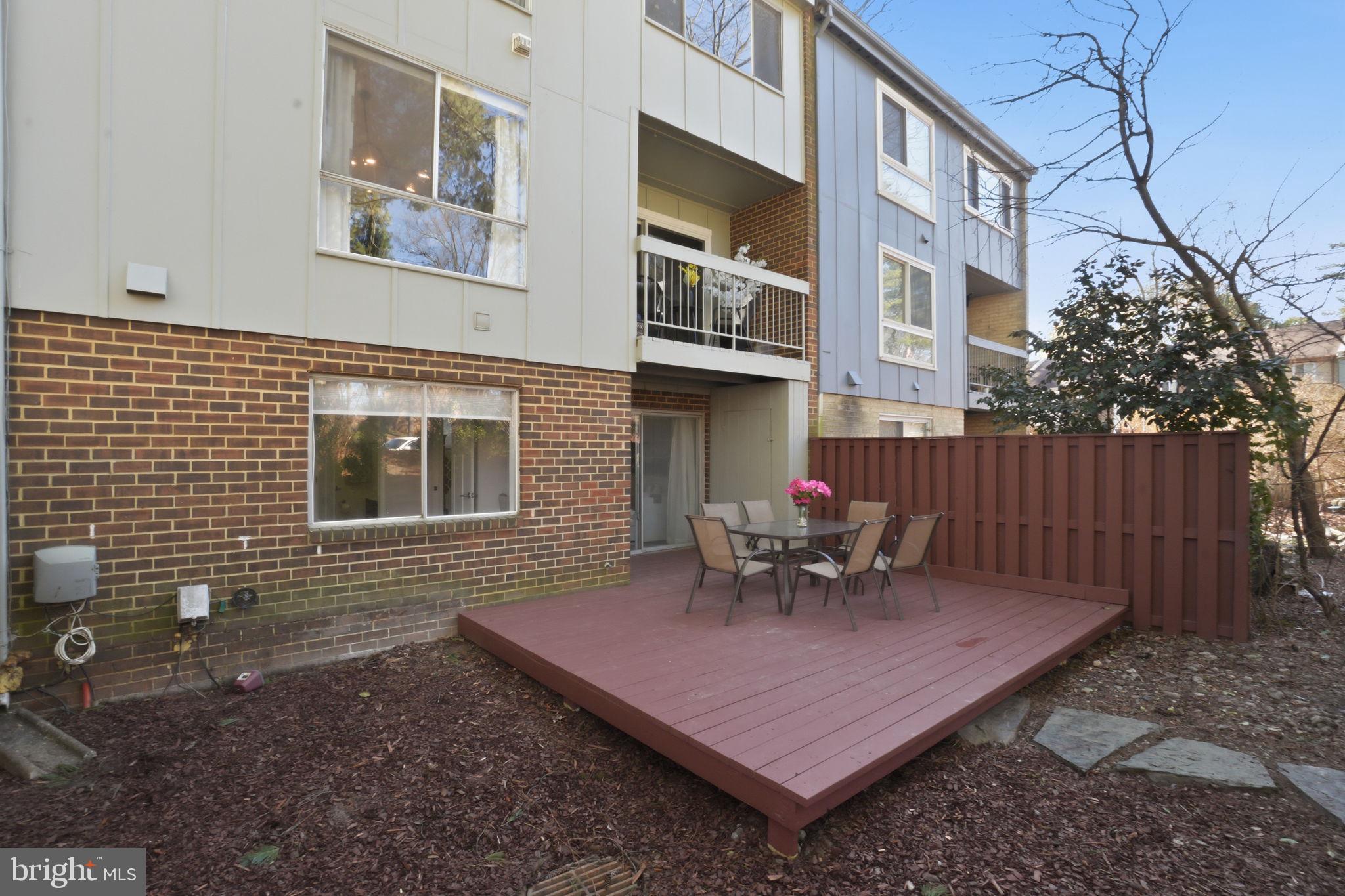 11025 Saffold Way Reston, VA 20190 - Photo 33 of 50 a view of a chairs and table in the backyard