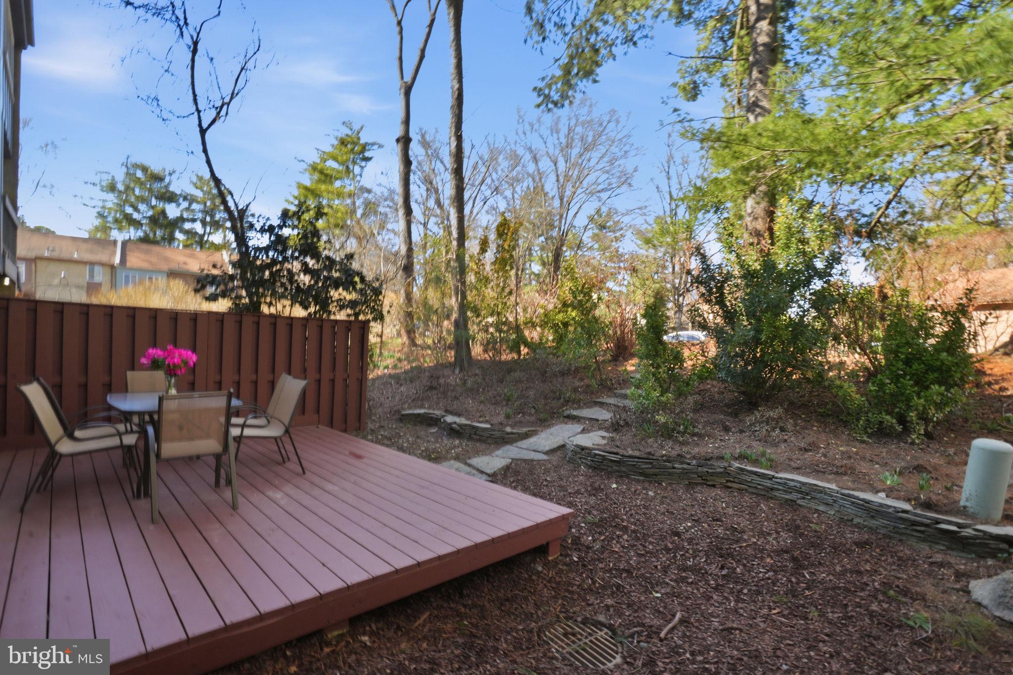11025 Saffold Way Reston, VA 20190 - Photo 34 of 50 a wooden bench sitting in backside of a house