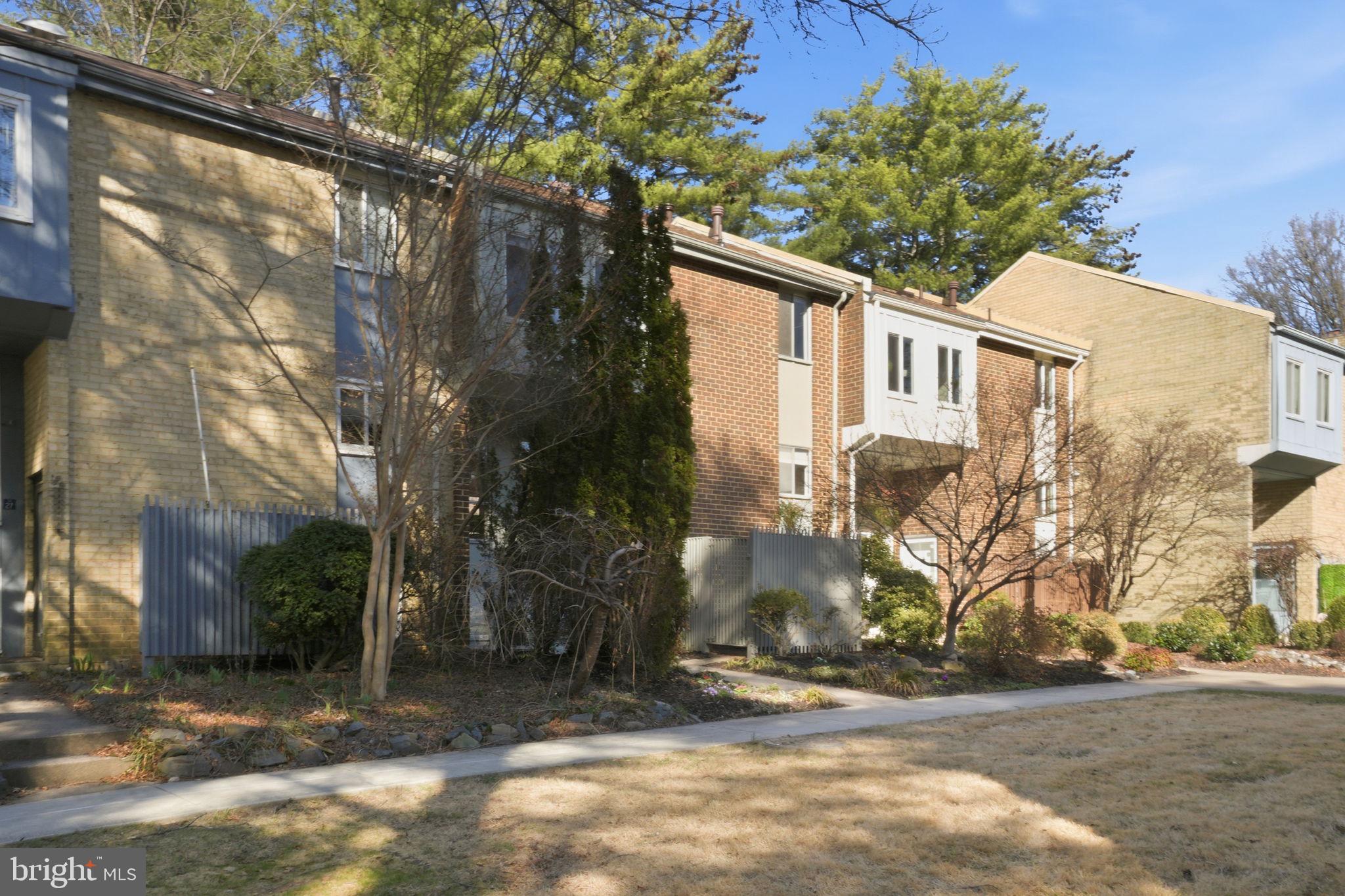 11025 Saffold Way Reston, VA 20190 - Photo 37 of 50 a view of a house with a yard