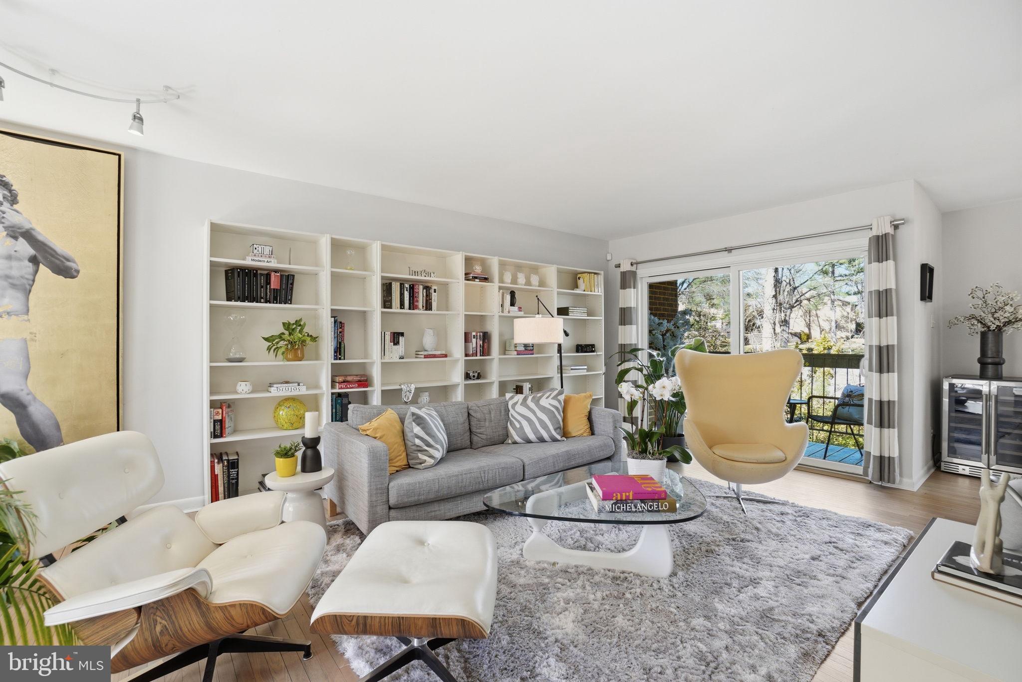 11025 Saffold Way Reston, VA 20190 - Photo 4 of 50 a living room with furniture and wooden floor