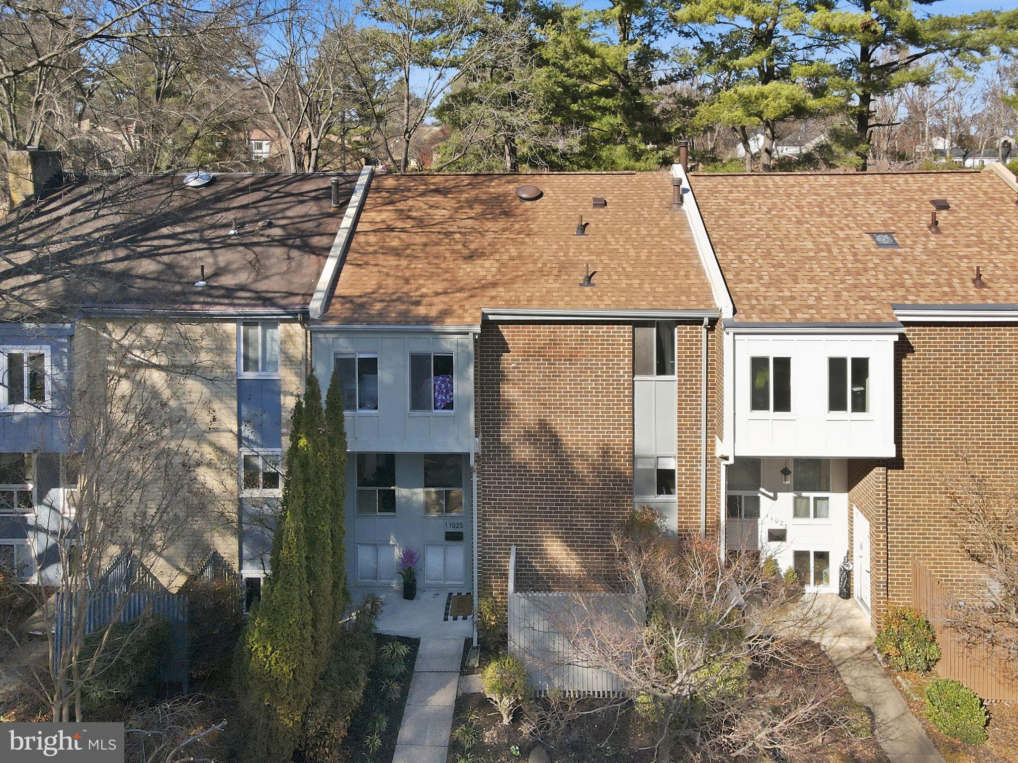 11025 Saffold Way Reston, VA 20190 - Photo 38 of 50 an aerial view of a house with a yard