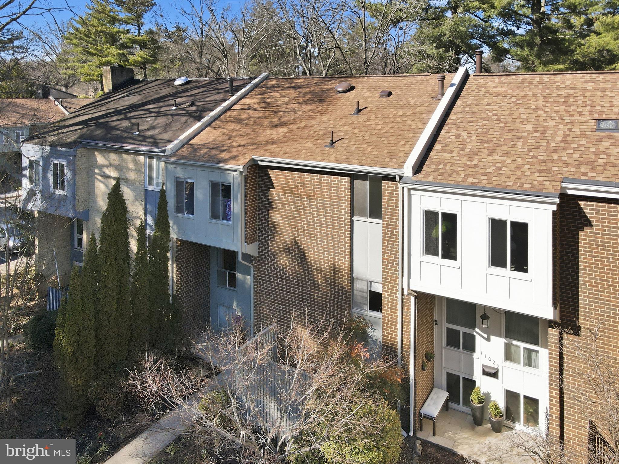 11025 Saffold Way Reston, VA 20190 - Photo 39 of 50 a aerial view of a house with a yard