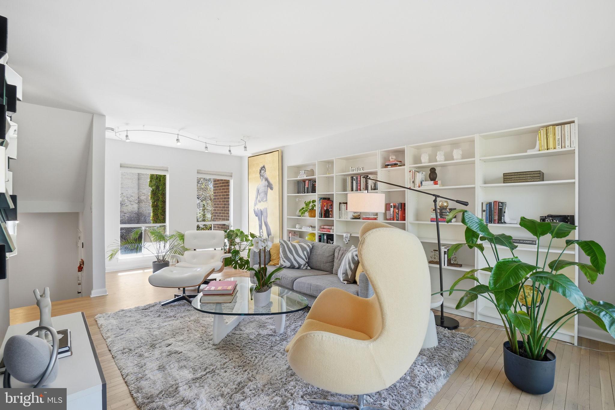 11025 Saffold Way Reston, VA 20190 - Photo 5 of 50 a living room with furniture and a potted plant