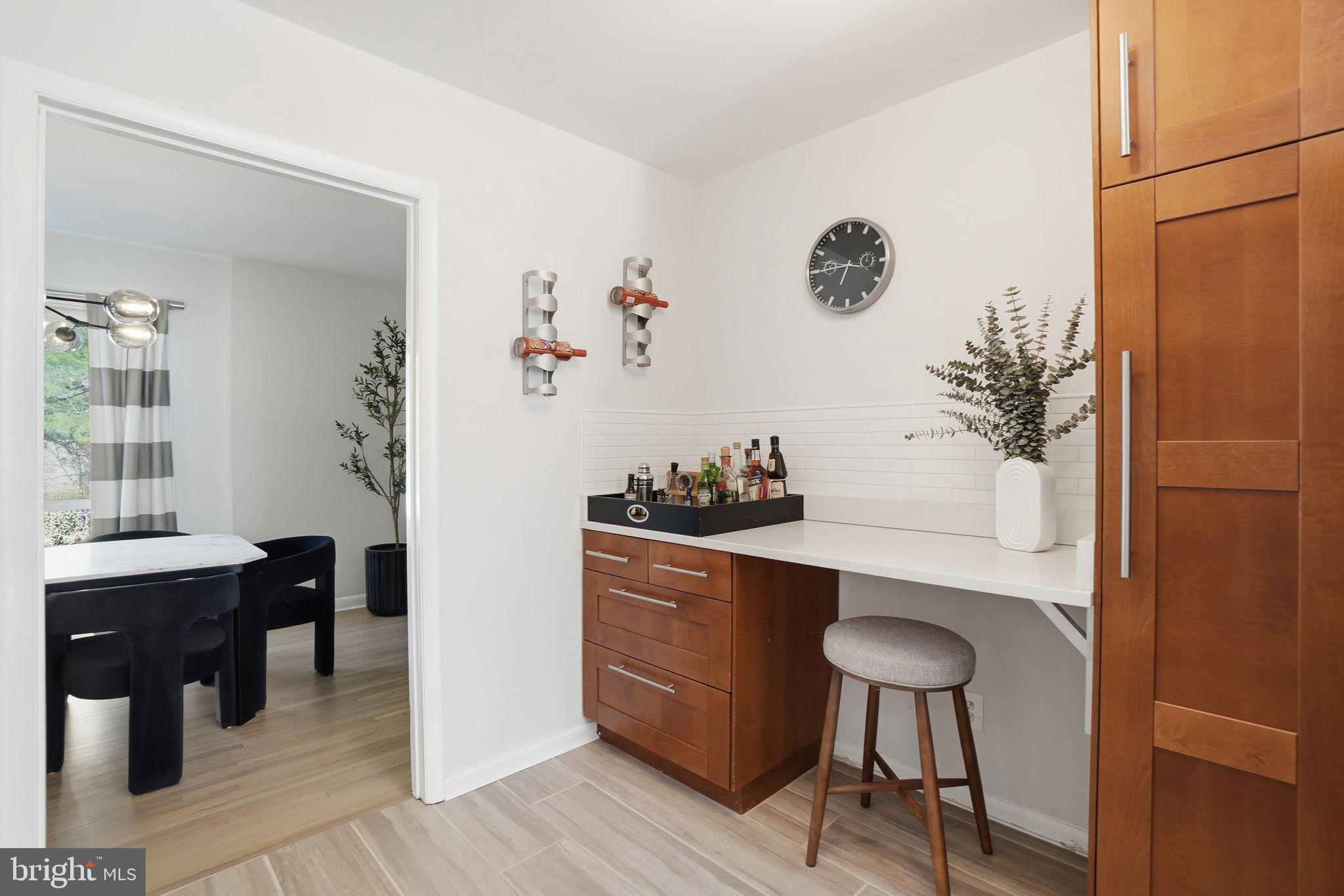11025 Saffold Way Reston, VA 20190 - Photo 10 of 50 a view of a workspace with furniture and a potted plant