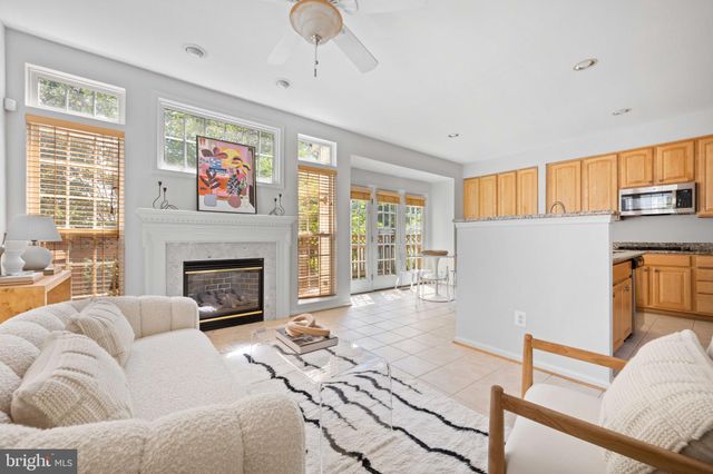 a kitchen with a stove a table and chairs