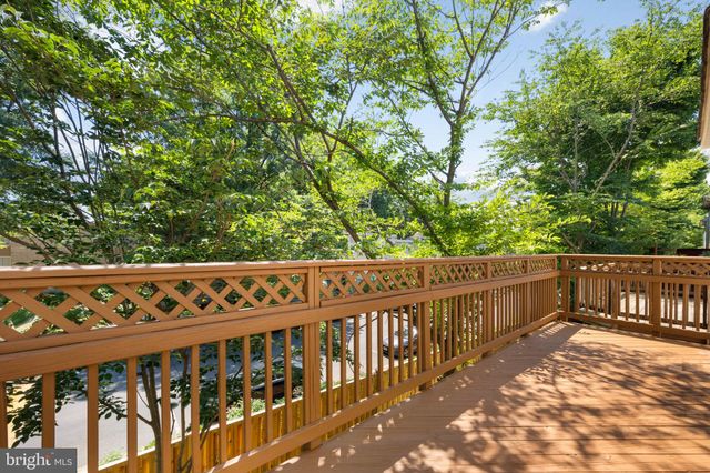 a bedroom with a bed and a potted plant