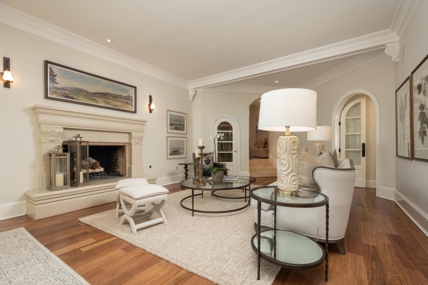 521 Roehampton Road Hillsborough, CA 94010 - Photo 12 of 51 a living room with furniture a fireplace and wooden floor