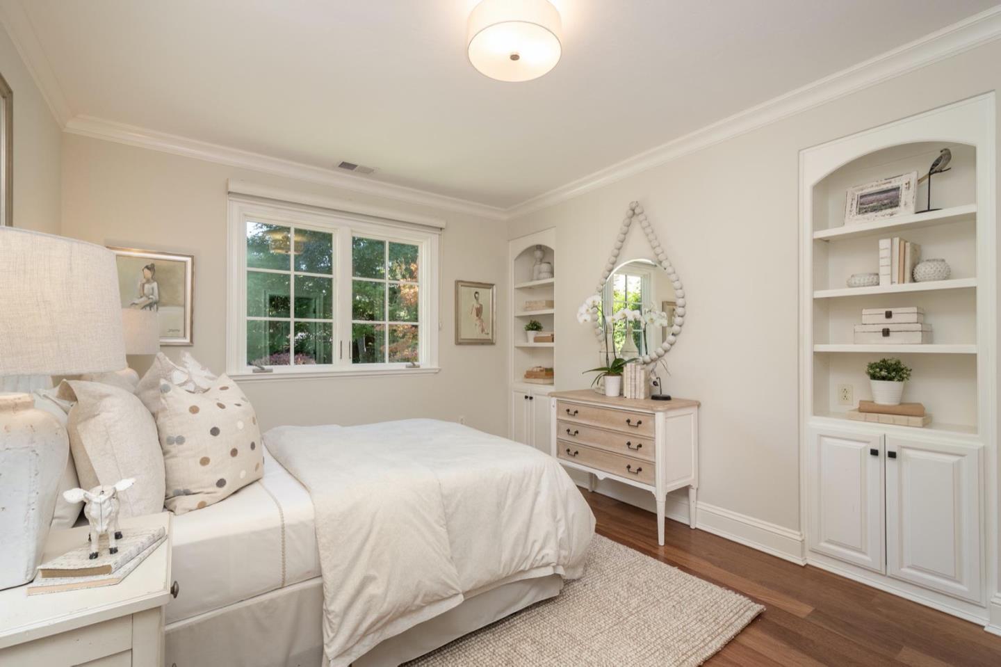 521 Roehampton Road Hillsborough, CA 94010 - Photo 25 of 51 a bedroom with a bed and a window