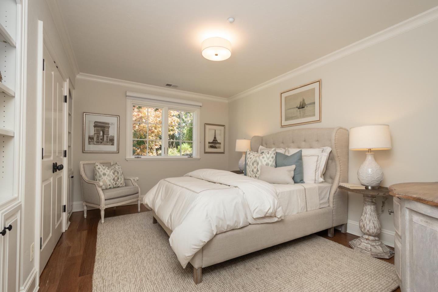 521 Roehampton Road Hillsborough, CA 94010 - Photo 27 of 51 a bedroom with a bed and wooden floor