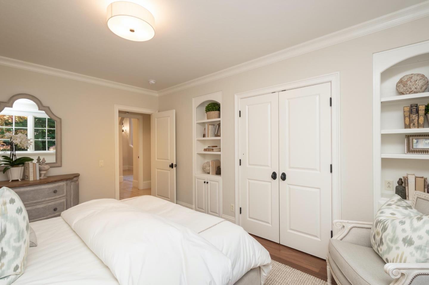 521 Roehampton Road Hillsborough, CA 94010 - Photo 28 of 51 a bedroom with a bed and a view of bathroom