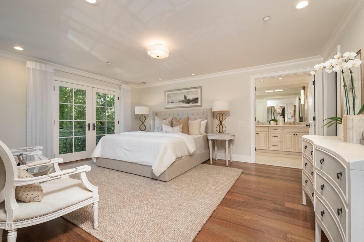 521 Roehampton Road Hillsborough, CA 94010 - Photo 31 of 51 a spacious bedroom with a bed a table and large window