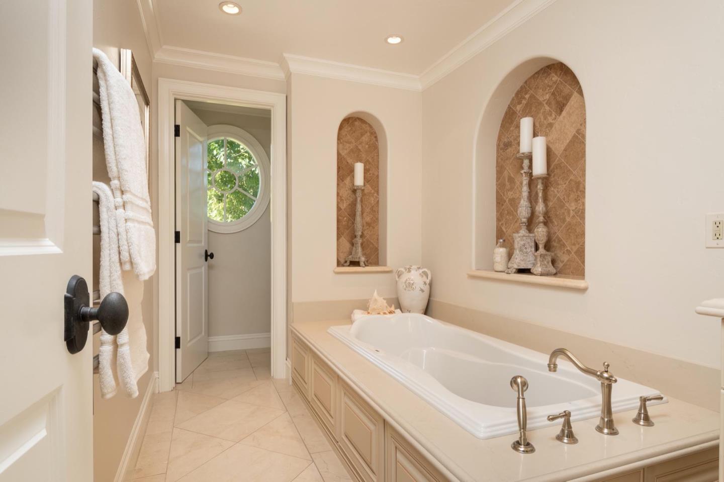 521 Roehampton Road Hillsborough, CA 94010 - Photo 33 of 51 a bathroom with a tub and a window