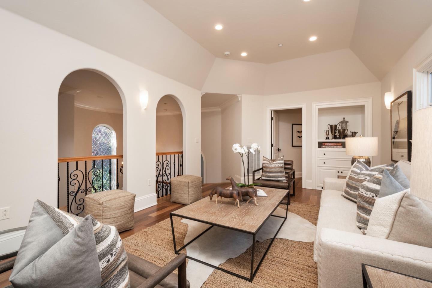 521 Roehampton Road Hillsborough, CA 94010 - Photo 36 of 51 a living room with furniture and a large mirror