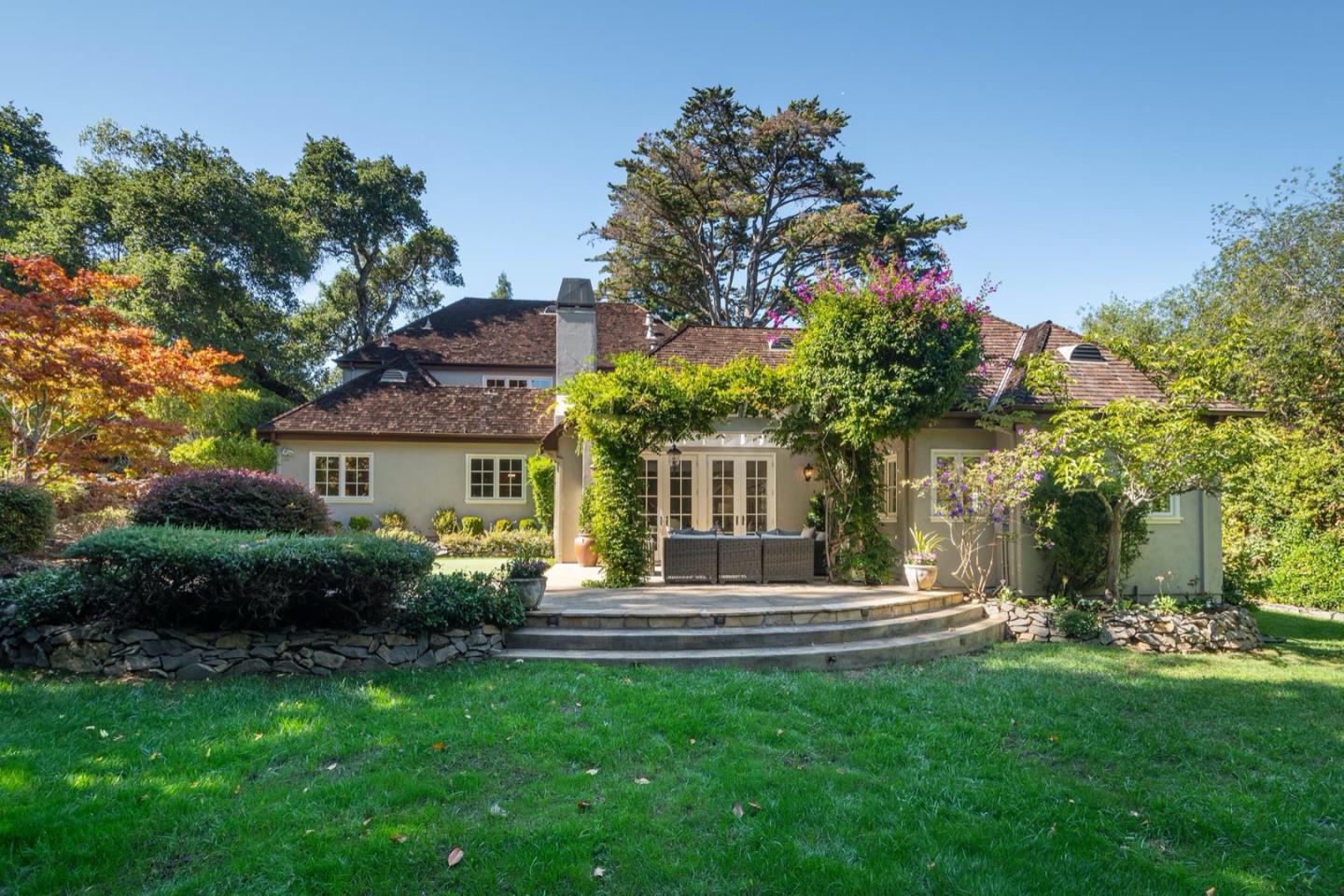 521 Roehampton Road Hillsborough, CA 94010 - Photo 41 of 51 a front view of a house with a garden