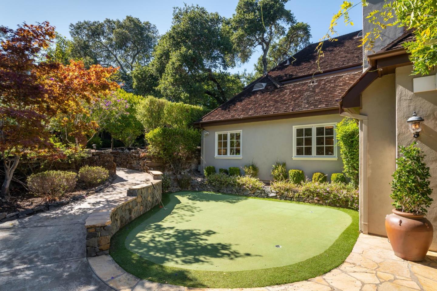 521 Roehampton Road Hillsborough, CA 94010 - Photo 44 of 51 a view of a backyard with plants and tree