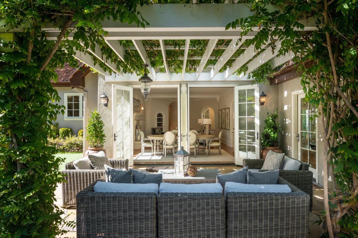 521 Roehampton Road Hillsborough, CA 94010 - Photo 45 of 51 a view of house with patio outdoor seating and plants