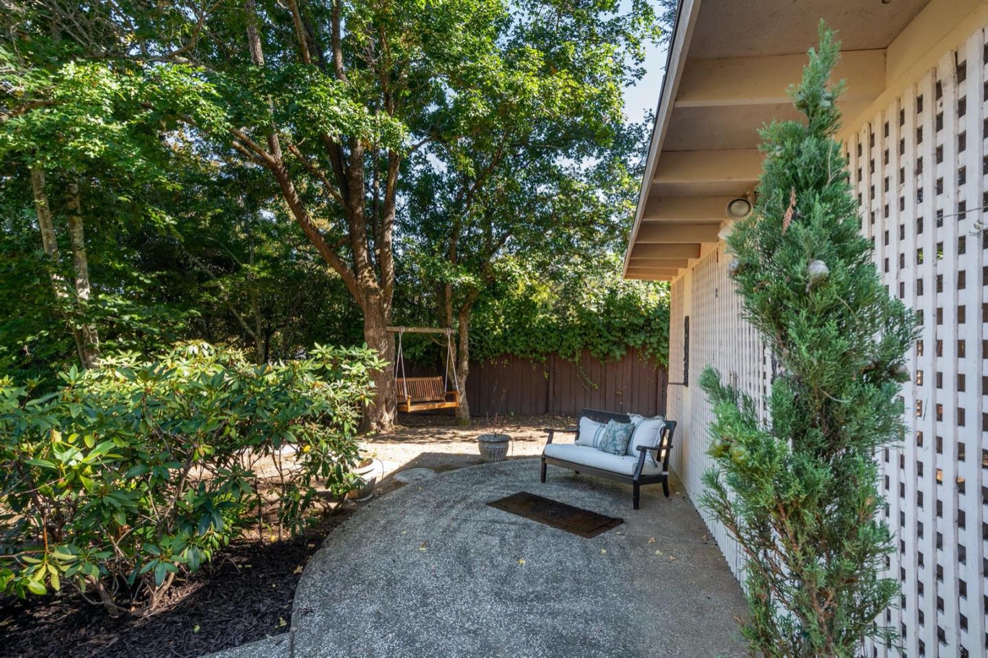 521 Roehampton Road Hillsborough, CA 94010 - Photo 48 of 51 a view of a backyard with sitting area and garden