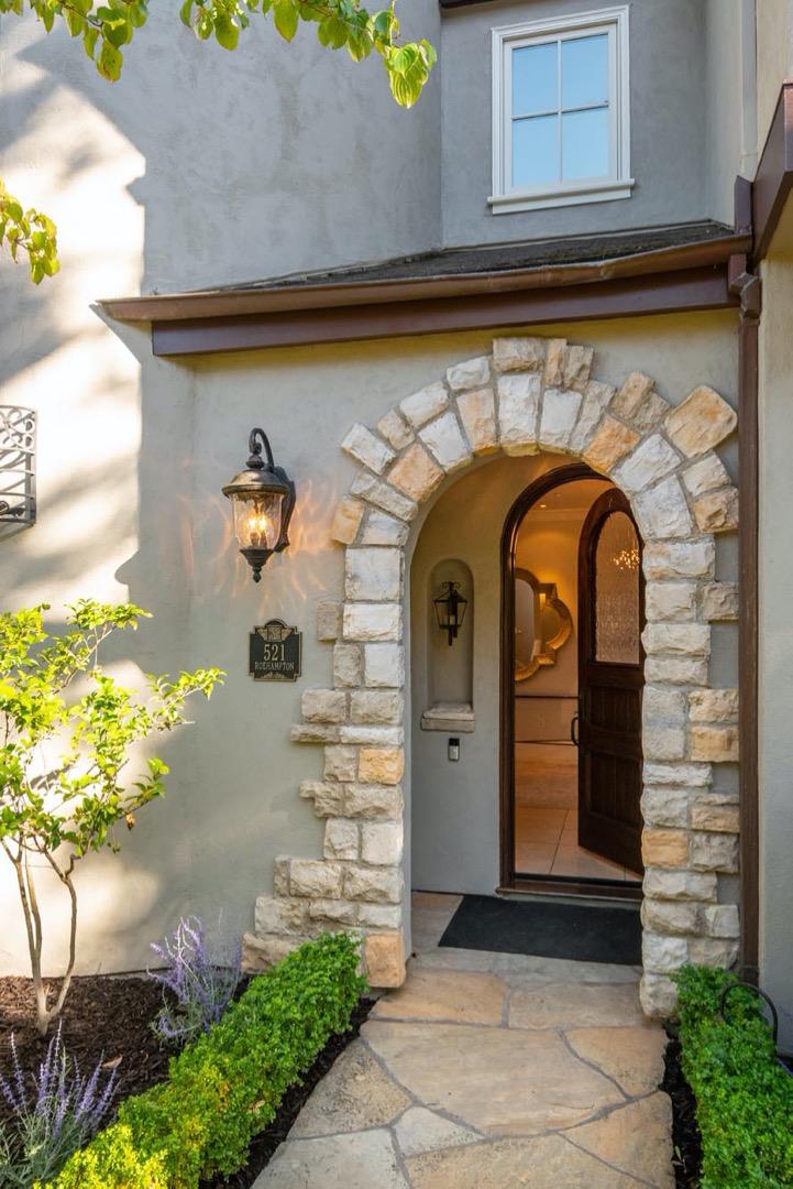 521 Roehampton Road Hillsborough, CA 94010 - Photo 5 of 51 a front view of a house with a garage