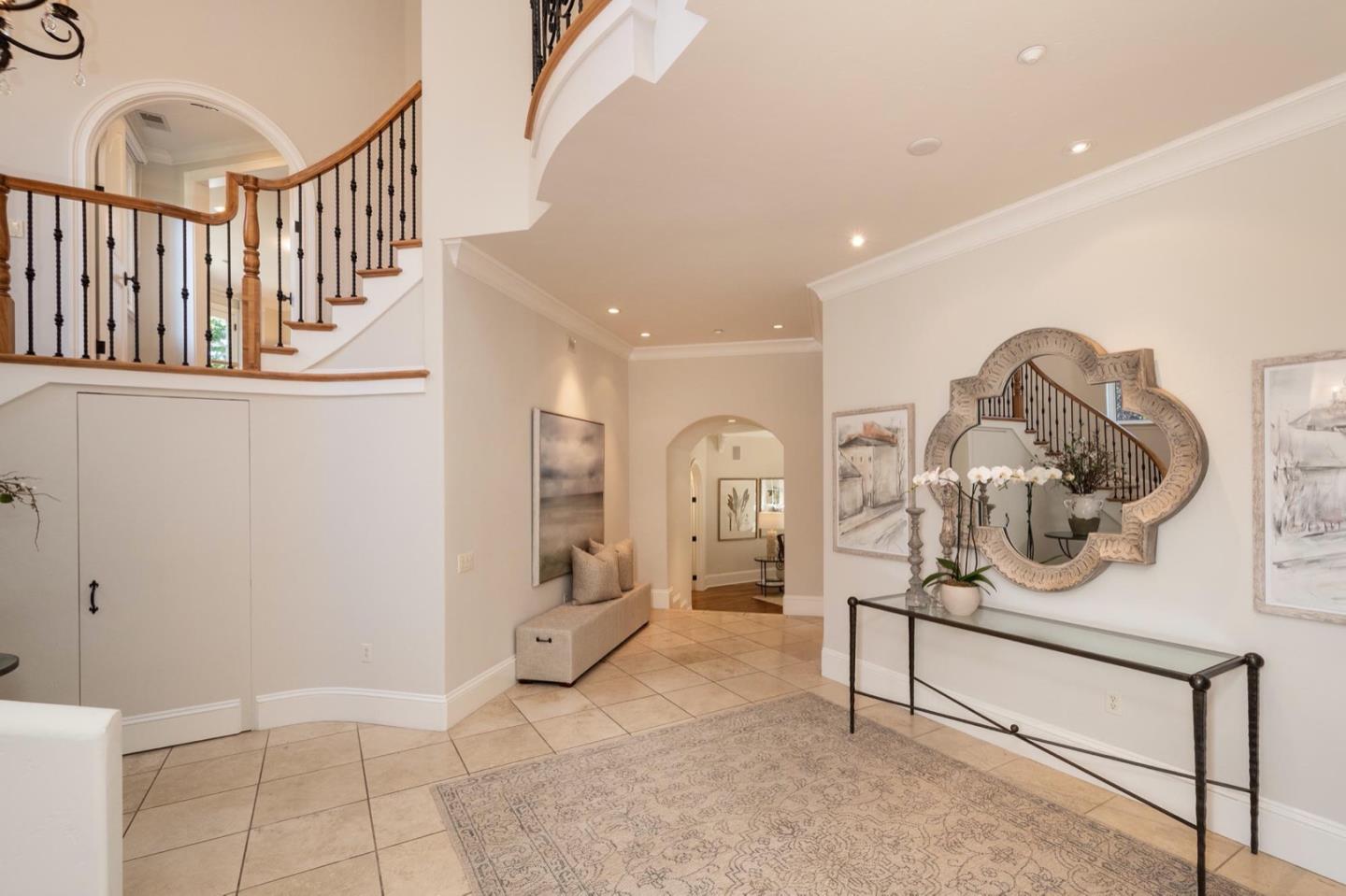 521 Roehampton Road Hillsborough, CA 94010 - Photo 8 of 51 a view of a hallway with dining room and wooden floor