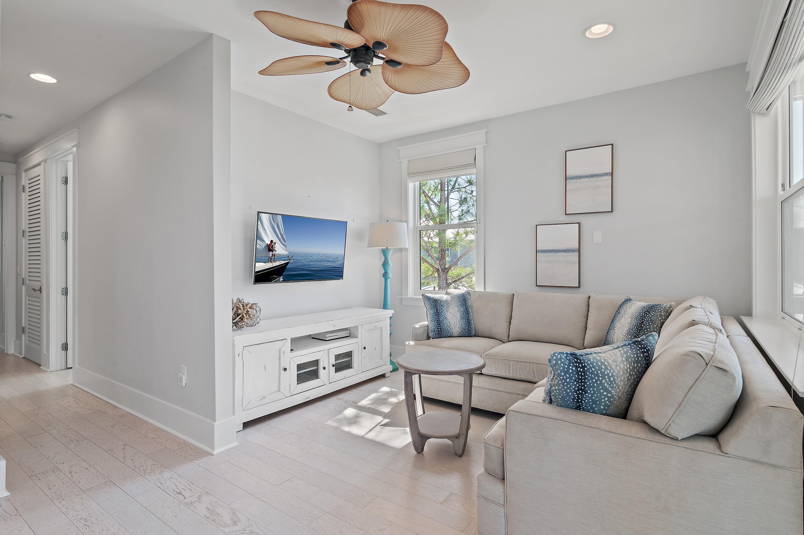 260 Flatwoods Forest Loop Santa Rosa Beach, FL 32459 - Photo 19 of 32 a living room with furniture and a flat screen tv
