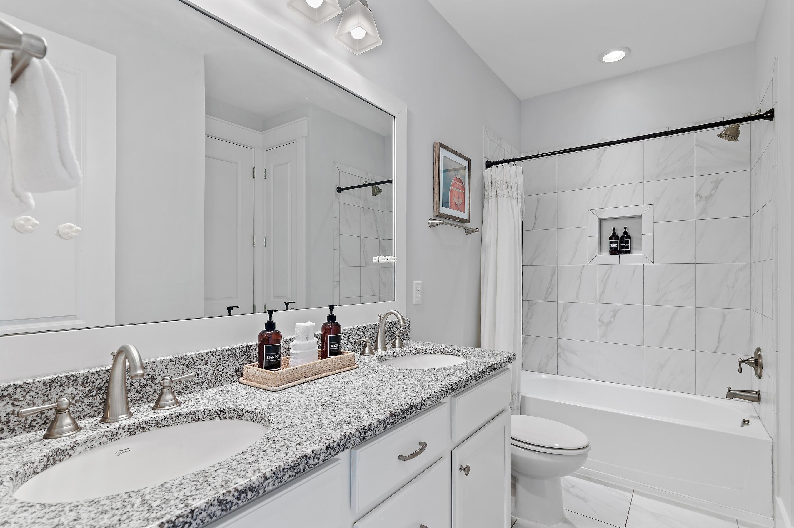 260 Flatwoods Forest Loop Santa Rosa Beach, FL 32459 - Photo 21 of 32 a bathroom with a granite countertop sink a toilet and bathtub