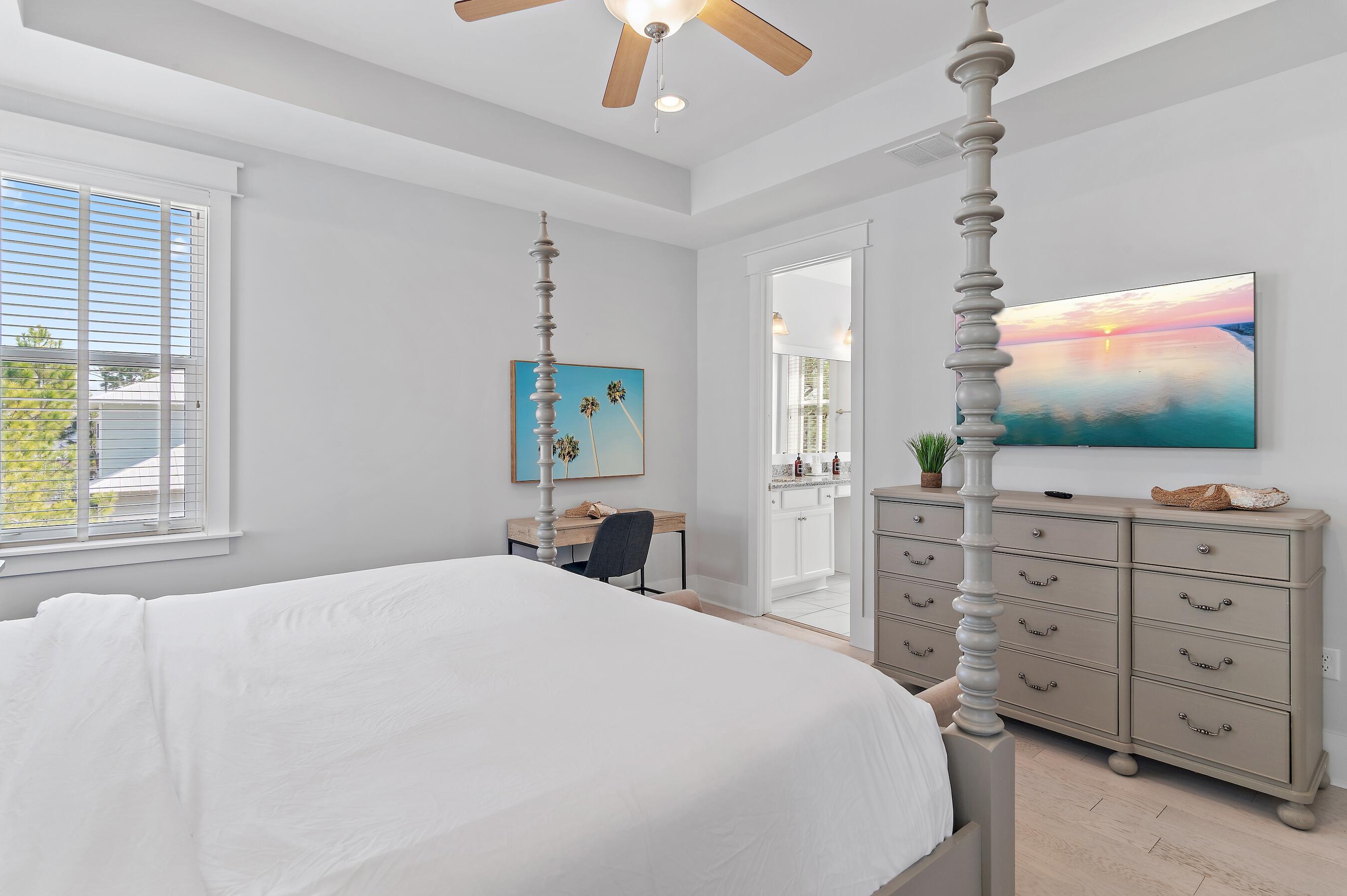 260 Flatwoods Forest Loop Santa Rosa Beach, FL 32459 - Photo 26 of 32 a bedroom with a bed and a flat screen tv