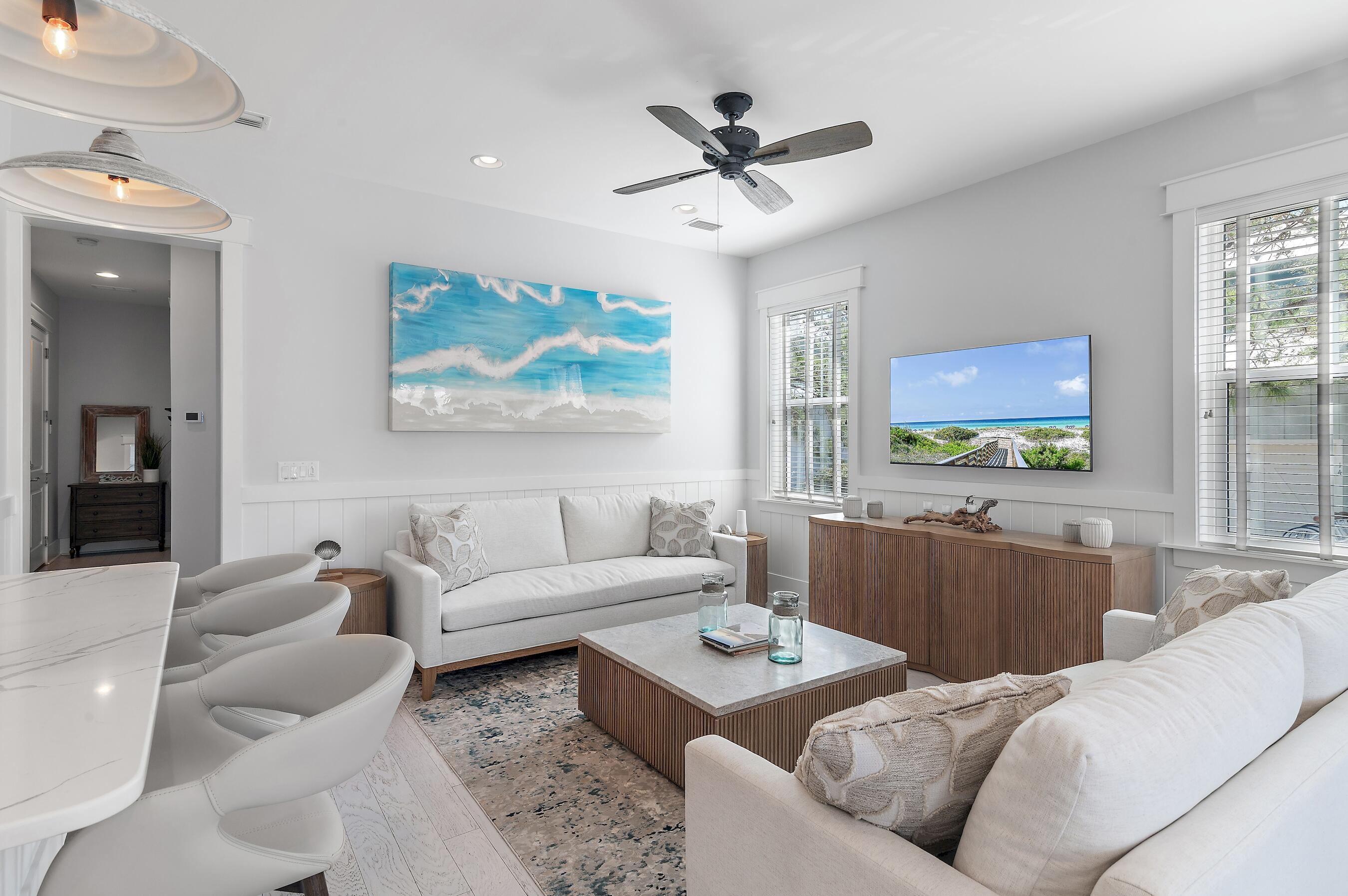 260 Flatwoods Forest Loop Santa Rosa Beach, FL 32459 - Photo 4 of 32 a living room with furniture and a large window