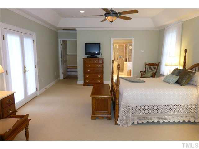 1555 Hanford Road Graham, NC 27253 - Photo 11 of 25 a bedroom with a bed and a television