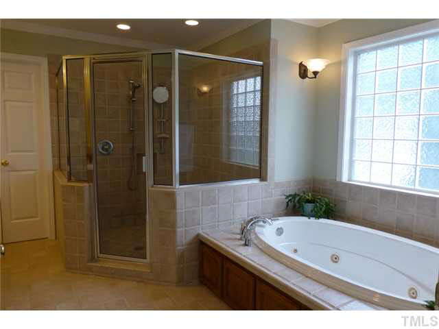 1555 Hanford Road Graham, NC 27253 - Photo 12 of 25 a bathroom with a granite countertop sink a mirror and shower