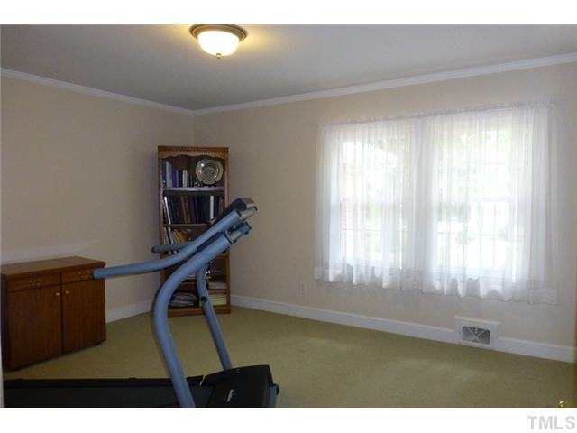1555 Hanford Road Graham, NC 27253 - Photo 17 of 25 a view of an empty room with windows