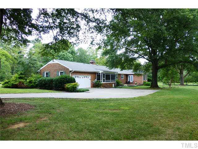 1555 Hanford Road Graham, NC 27253 - Photo 3 of 25 a front view of a house with a garden