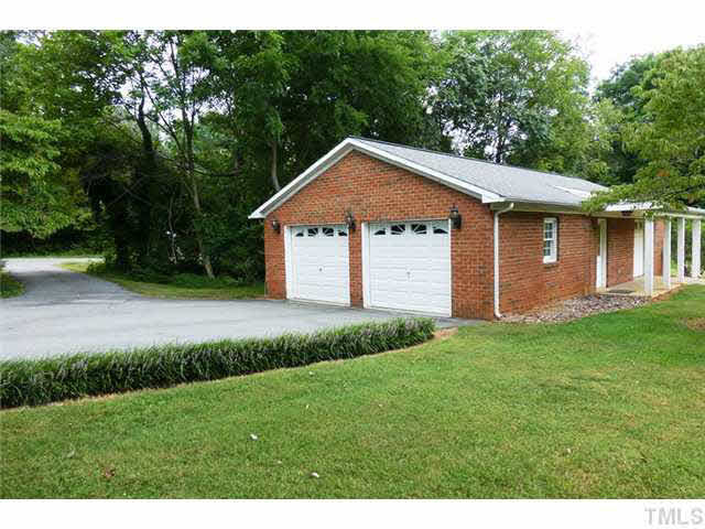 1555 Hanford Road Graham, NC 27253 - Photo 25 of 25 a front view of a house with a yard and garage