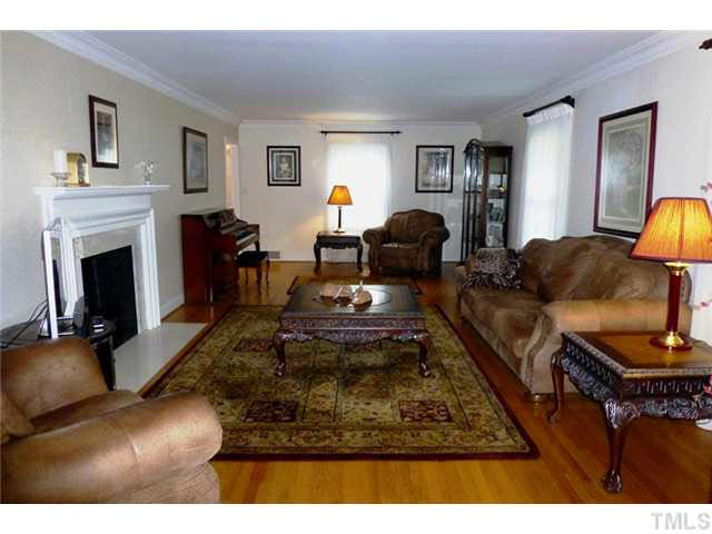 1555 Hanford Road Graham, NC 27253 - Photo 5 of 25 a living room with furniture and a fireplace