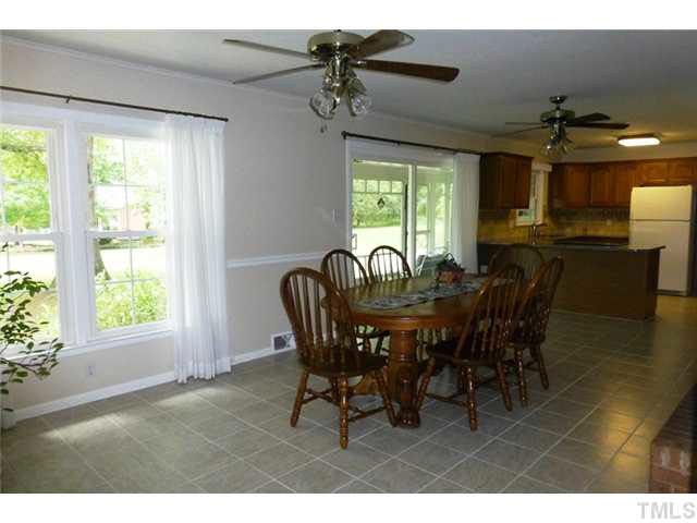 1555 Hanford Road Graham, NC 27253 - Photo 6 of 25 a view of a dining room with furniture window and outside view