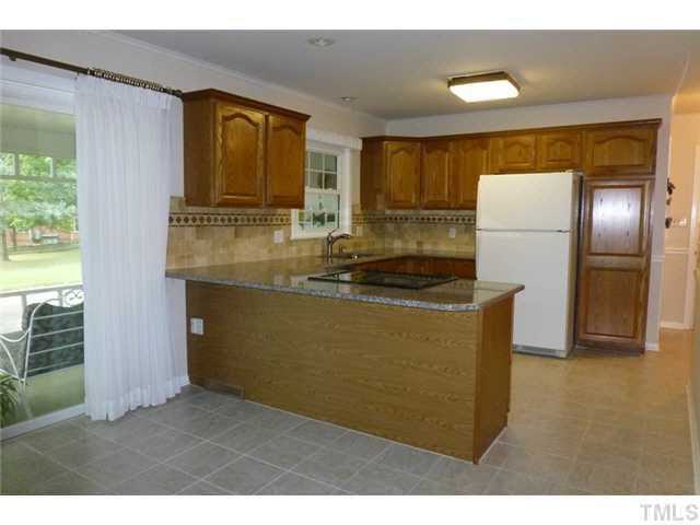 1555 Hanford Road Graham, NC 27253 - Photo 8 of 25 a kitchen with refrigerator and window