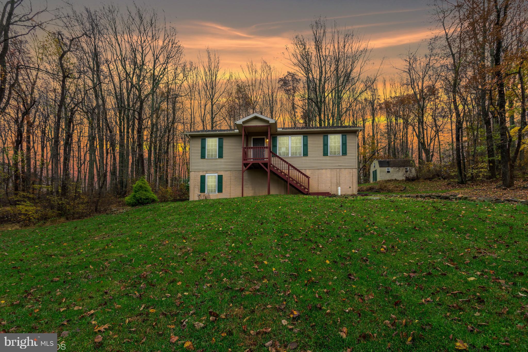 322 Freeze Road Linden, VA 22642 - Photo 1 of 26 a view of a house with backyard and garden