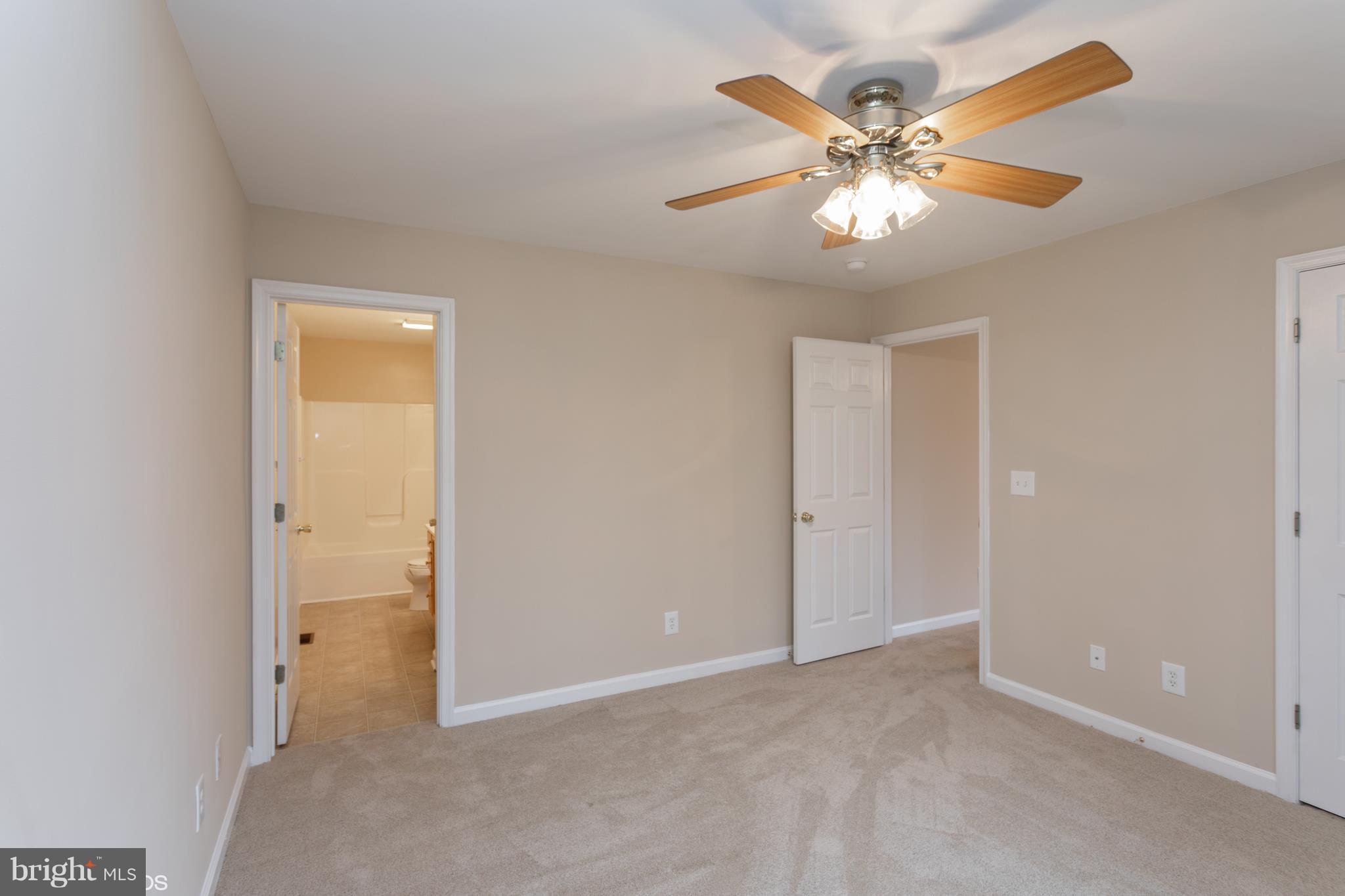 322 Freeze Road Linden, VA 22642 - Photo 15 of 26 a view of an empty room with a fan