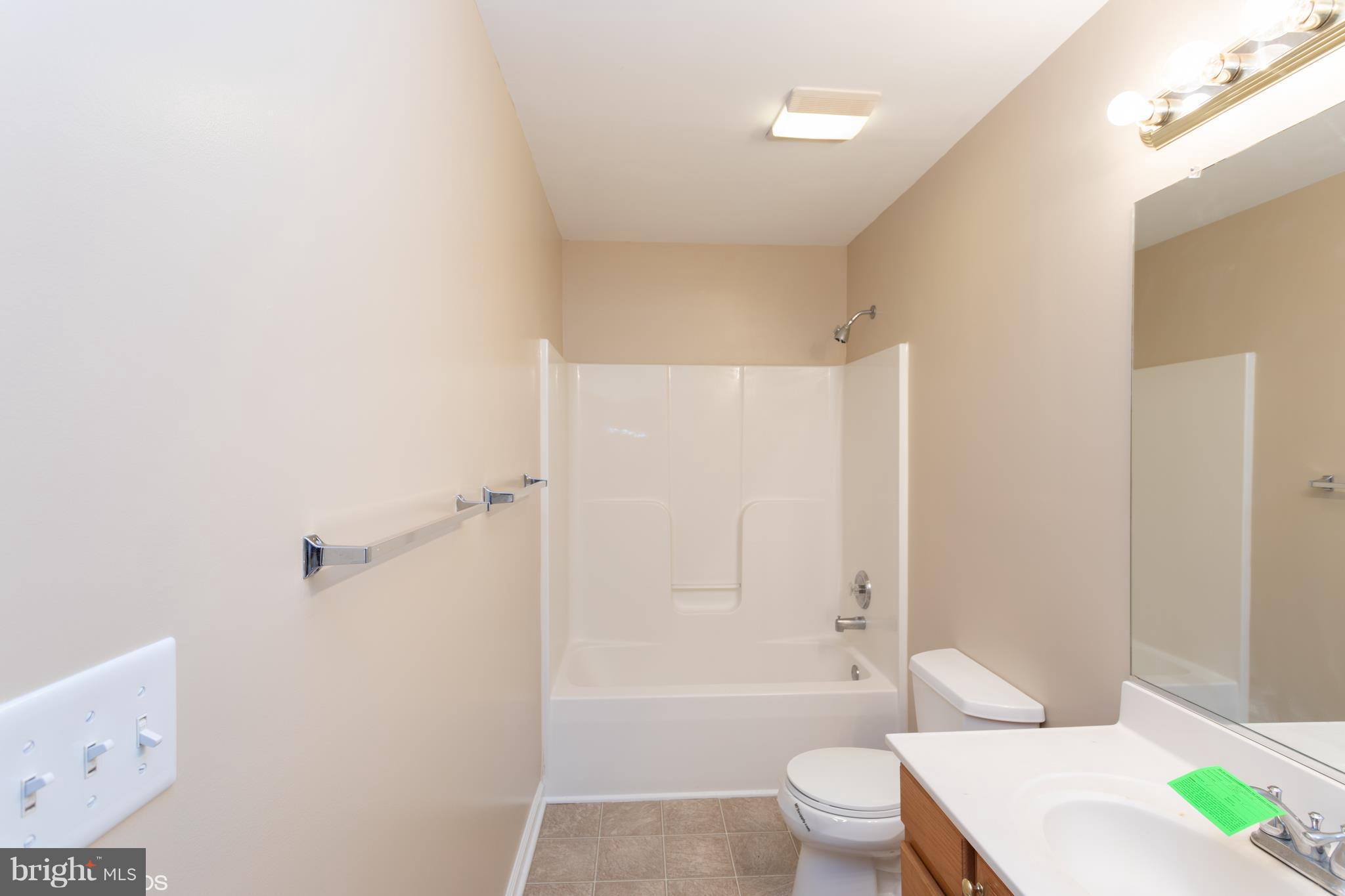 322 Freeze Road Linden, VA 22642 - Photo 17 of 26 a bathroom with a toilet a sink and bathtub