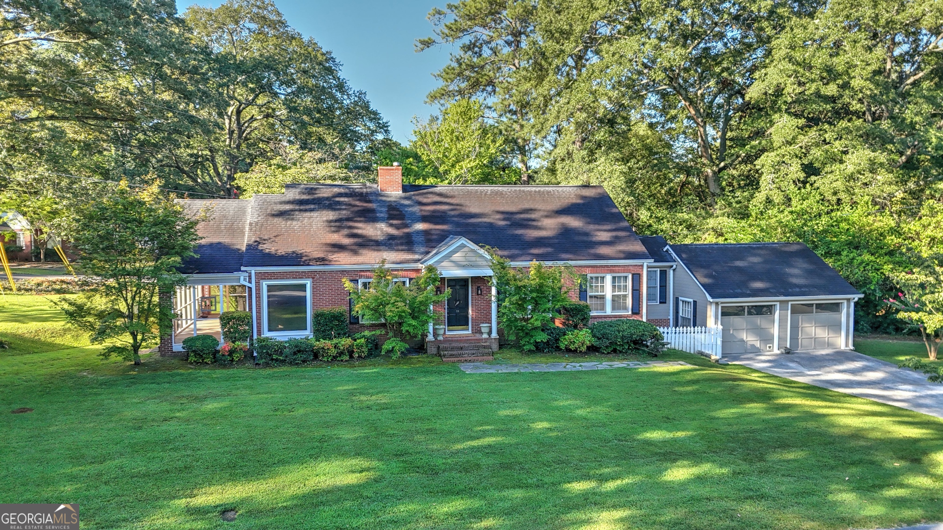 a house with garden in front of it
