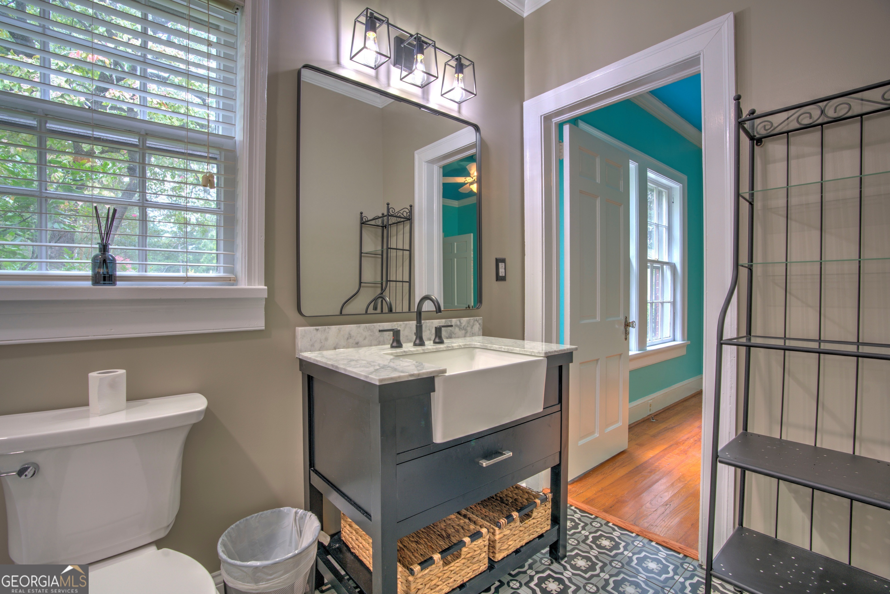 19 Berckmans Lane Southwest Rome, GA 30165 - Photo 14 of 26 a bathroom with a sink a toilet a mirror and window