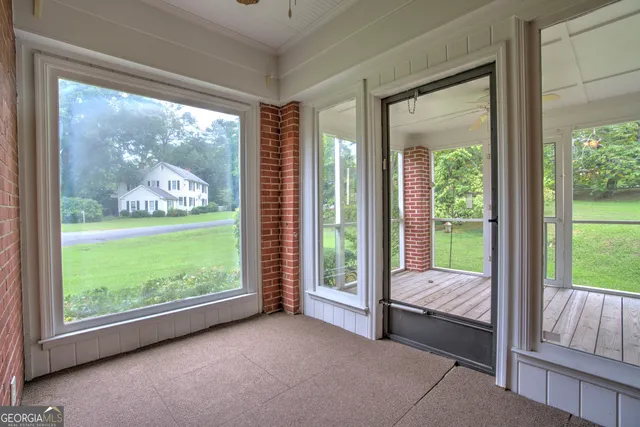 a bed sitting in a room next to a window