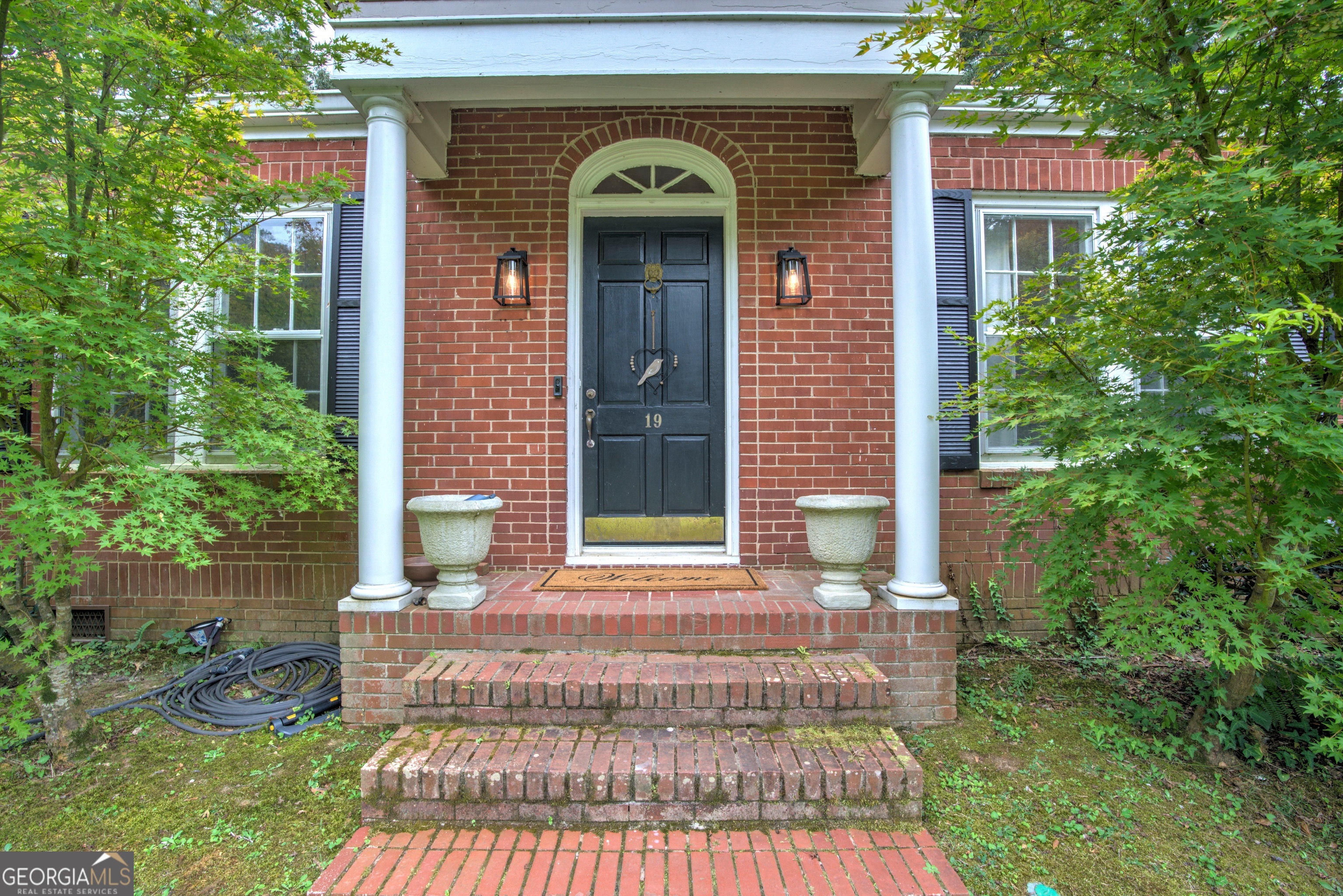 19 Berckmans Lane Southwest Rome, GA 30165 - Photo 2 of 26 a front view of a house with garden